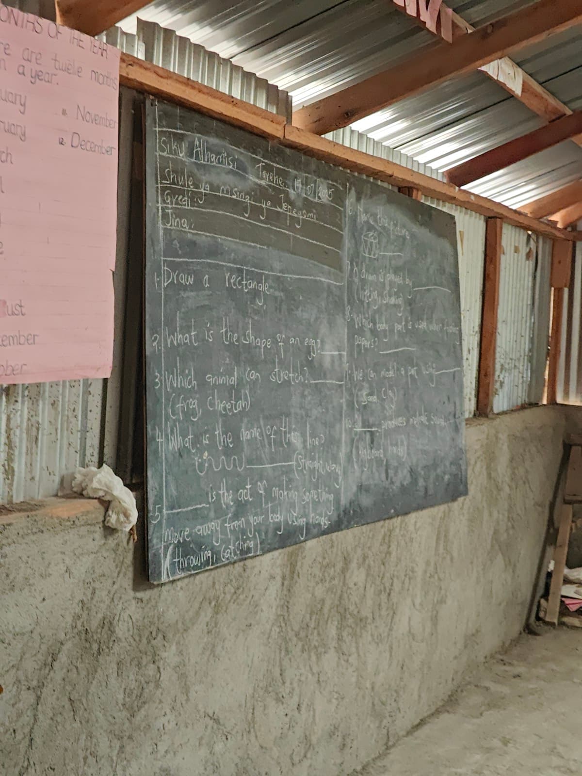 A blackboard mounted on a rough plastered wall with a lesson written on it in chalk