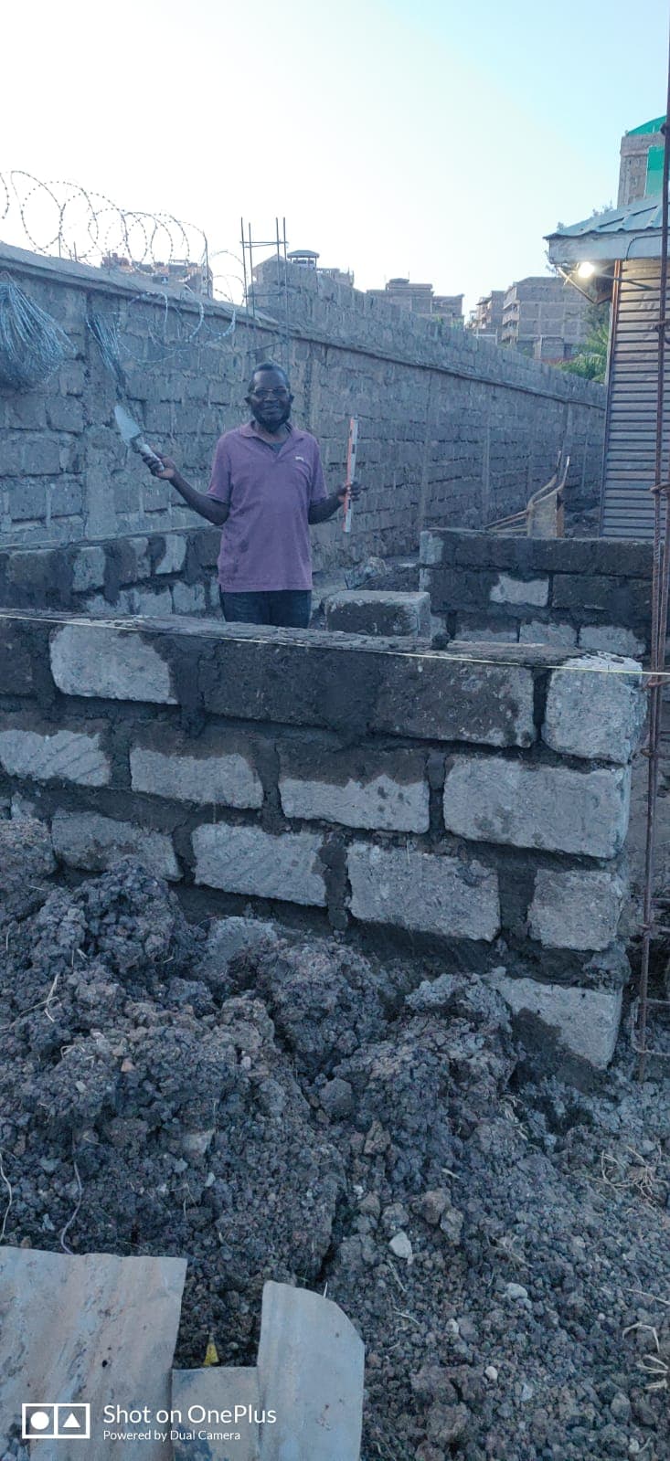 Laying the first courses of the kitchen wall