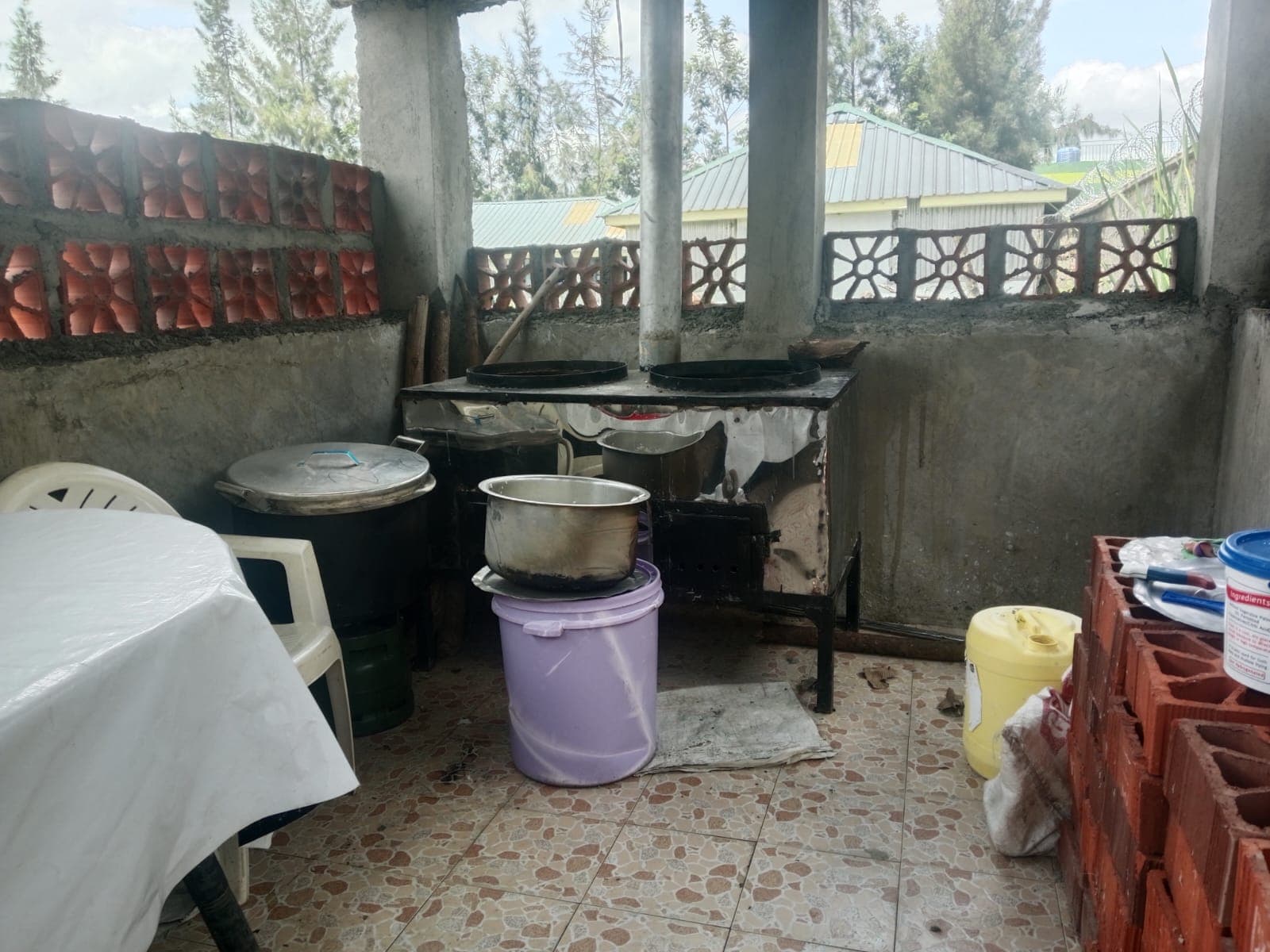 Inside — the jiko in place on a tiled floor